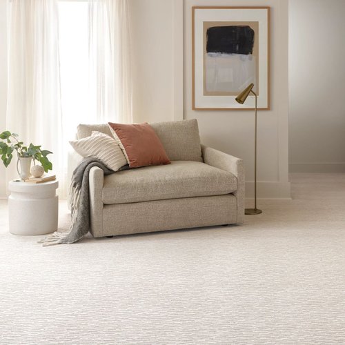 white carpet and small beige sofa on Fort Morgan, CO area by Specialty Shoppe Floors
