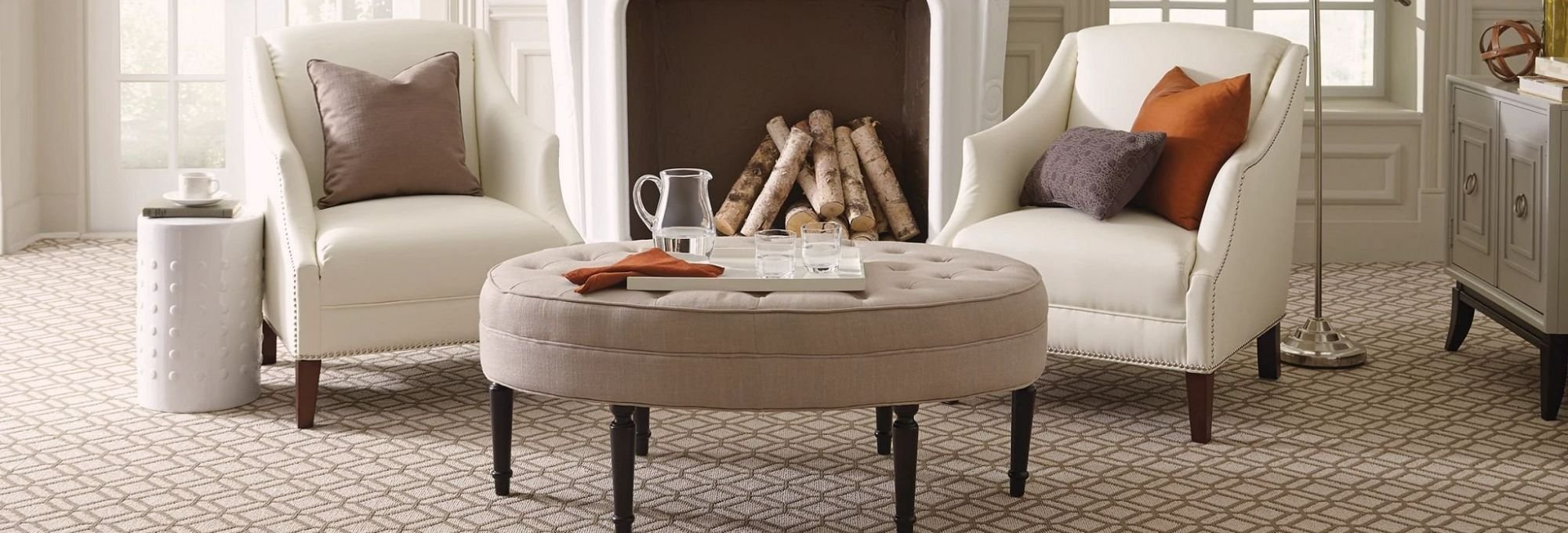 white armchair in living room with patterned carpet on Fort Morgan, CO area by Specialty Shoppe Floors